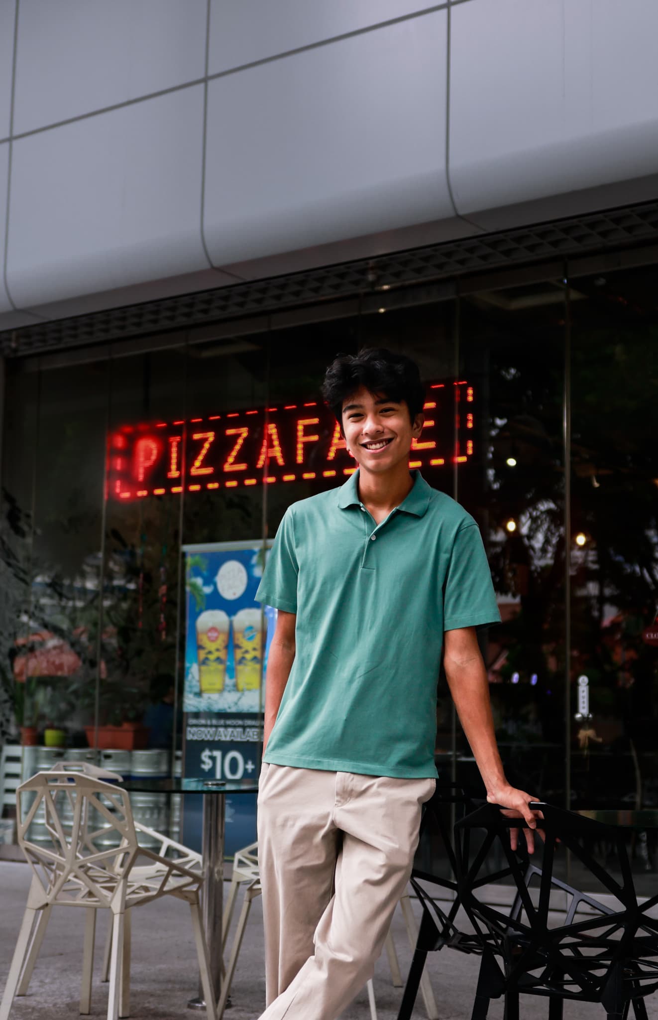 Founder of ZTK Media standing outside a storefront